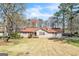 Charming single-story home with a well-maintained lawn and mature trees in a peaceful setting at 104 Amberidge Nw Dr, Cartersville, GA 30121
