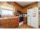 View of the Kitchen with stainless steel sink, oven, refrigerator, and wood cabinets at 104 Amberidge Nw Dr, Cartersville, GA 30121