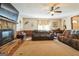 The living room boasts an inviting layout, featuring a cozy stone fireplace and comfortable seating for relaxation at 104 Amberidge Nw Dr, Cartersville, GA 30121