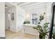 Inviting bathroom with a standalone tub, plant accents, and wood floors at 1009 Institute Nw St, Conyers, GA 30012
