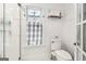 Cozy bathroom features beadboard walls, a patterned curtain, and tile flooring at 1009 Institute Nw St, Conyers, GA 30012