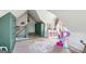 Attic bedroom with charming built-ins and angled ceilings; rug and natural light at 1009 Institute Nw St, Conyers, GA 30012