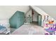 Attic bedroom with charming built-ins and angled ceilings; rug and natural light at 1009 Institute Nw St, Conyers, GA 30012