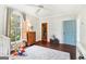Bright Bedroom featuring light walls, wood floors, a ceiling fan and lots of toys at 1009 Institute Nw St, Conyers, GA 30012