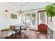 Cozy dining room with large windows, bench seating and a cottage ceiling at 1009 Institute Nw St, Conyers, GA 30012