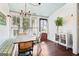 Cozy dining room with large windows, a wooden floor, and a cottage ceiling at 1009 Institute Nw St, Conyers, GA 30012