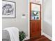 Charming entryway with a wooden door, hardwood floors, and stylish decor at 1009 Institute Nw St, Conyers, GA 30012