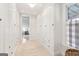 Hallway featuring lots of storage, wood floors, neutral walls, with a peak into the bedroom at 1009 Institute Nw St, Conyers, GA 30012