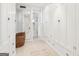 Bright hallway with hardwood floors, built-in cabinets, and a decorative woven basket at 1009 Institute Nw St, Conyers, GA 30012