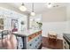 Bright kitchen featuring a marble island, hardwood floors, and pendant lighting at 1009 Institute Nw St, Conyers, GA 30012