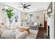 Bright living room with large windows, hardwood floors, and comfortable seating at 1009 Institute Nw St, Conyers, GA 30012