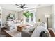 Spacious living room with a bay window, hardwood floors, and comfortable seating at 1009 Institute Nw St, Conyers, GA 30012