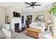 Inviting living room with a fireplace, ceiling fan and hardwood floors at 1009 Institute Nw St, Conyers, GA 30012
