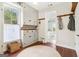 Mud room with custom storage cabinets, wood floors, a jute rug, and a window for natural light at 1009 Institute Nw St, Conyers, GA 30012