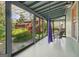 Inviting screened porch with comfortable seating and views of the lush backyard at 1009 Institute Nw St, Conyers, GA 30012