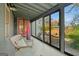Picturesque screened porch with outdoor seating and views of the landscaped backyard at 1009 Institute Nw St, Conyers, GA 30012