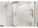 Modern tiled shower with glass enclosure and coordinating fixtures at 1009 Institute Nw St, Conyers, GA 30012