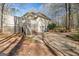 Backyard boasts a spacious deck with stairs, a sliding glass door, and lush landscaping at 115 Flagstop Run, Fayetteville, GA 30215