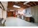 Unfinished basement space with storage, and garage access at 115 Flagstop Run, Fayetteville, GA 30215