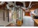 Basement with HVAC system, water heater, and unfinished space, showing essential home systems and storage potential at 115 Flagstop Run, Fayetteville, GA 30215