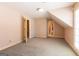 Carpeted bedroom with natural light, featuring a doorway to the Primary bath and walk-in closet at 115 Flagstop Run, Fayetteville, GA 30215