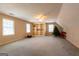 Spacious bonus room with a ceiling fan, two windows, and built in shelves that provides ample storage at 115 Flagstop Run, Fayetteville, GA 30215