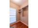 Bedroom closet with adjustable shelves, and a bright window at 115 Flagstop Run, Fayetteville, GA 30215
