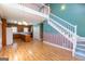 The Great Room features an open floor plan and a staircase leading to the upper floor at 115 Flagstop Run, Fayetteville, GA 30215