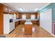 Large kitchen features a center island, ample cabinetry, and bright lighting at 115 Flagstop Run, Fayetteville, GA 30215