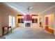 Spacious living room showcasing a fireplace, large window, and built-in shelving at 115 Flagstop Run, Fayetteville, GA 30215