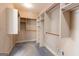 Spacious walk-in closet with ample shelving and hanging space for organized storage at 115 Flagstop Run, Fayetteville, GA 30215
