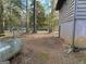 An exterior side view of the home's backyard featuring a dirt and minimal grass area at 191 Charles Cox Dr, Canton, GA 30115