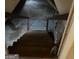 Wooden basement stairs leading down to a concrete floor at 191 Charles Cox Dr, Canton, GA 30115