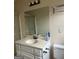 Bathroom sink with large mirror and sliding door shower at 191 Charles Cox Dr, Canton, GA 30115