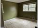 View of empty bedroom with two windows and green walls at 191 Charles Cox Dr, Canton, GA 30115