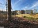 View of newly constructed building behind a wood fence under a partly cloudy sky at 191 Charles Cox Dr, Canton, GA 30115