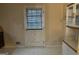 Kitchen area featuring white patterned door with metal doorknob, and tile flooring at 191 Charles Cox Dr, Canton, GA 30115