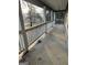 View of the home's porch, featuring aged concrete and an extended shadow pattern at 191 Charles Cox Dr, Canton, GA 30115
