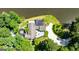 Aerial view of a modern home on a sprawling lot with lakeside frontage, deck, and patio at 129 Old Norton Rd, Fayetteville, GA 30215