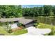 Aerial view of the house with a large circular driveway and backyard pond at 129 Old Norton Rd, Fayetteville, GA 30215