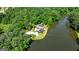 Stunning aerial view of a lakeside home surrounded by lush greenery and mature trees at 129 Old Norton Rd, Fayetteville, GA 30215