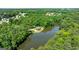 Scenic aerial view of a community lake surrounded by residences amid lush green canopy of trees at 129 Old Norton Rd, Fayetteville, GA 30215