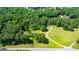 Birds eye view of landscaped yard with winding path and mature trees leading up to the property at 129 Old Norton Rd, Fayetteville, GA 30215