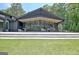Expansive back patio under an overhang of the home provides room for dining and relaxation at 129 Old Norton Rd, Fayetteville, GA 30215