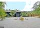 Backyard featuring a gravel area with stylish seating and lush landscaping at 129 Old Norton Rd, Fayetteville, GA 30215