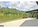 Enjoy the expansive backyard, complete with a tranquil lake, a lush lawn, and a patio at 129 Old Norton Rd, Fayetteville, GA 30215