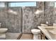 Modern bathroom featuring a gray tiled shower with glass door, and gray walls at 129 Old Norton Rd, Fayetteville, GA 30215