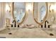 Bathroom with double sinks, custom mirrors, and an artistic design at 129 Old Norton Rd, Fayetteville, GA 30215