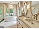 Luxurious bathroom with custom double vanity, soaking tub, and walk-in shower at 129 Old Norton Rd, Fayetteville, GA 30215