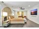 Bright, airy bedroom featuring dark hardwood floors and a sleek mounted television at 129 Old Norton Rd, Fayetteville, GA 30215